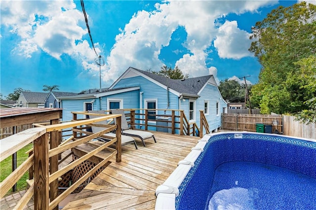 view of pool featuring a wooden deck