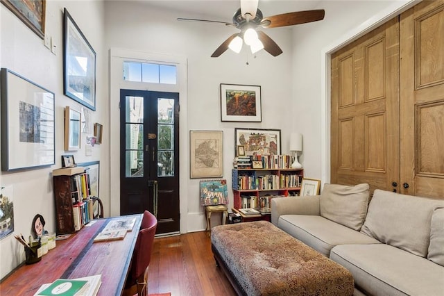 interior space with ceiling fan, french doors, and dark hardwood / wood-style floors