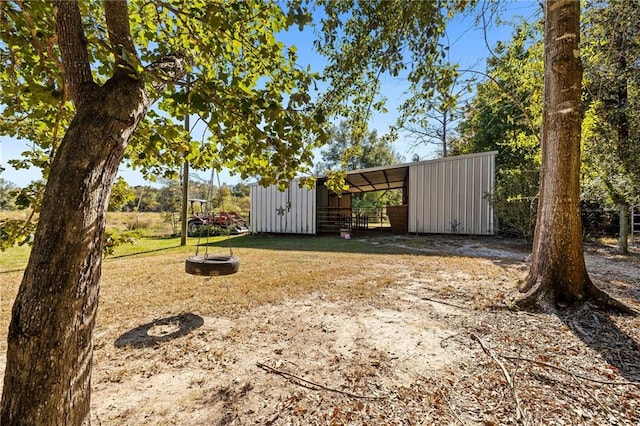 view of yard featuring an outbuilding and a fire pit