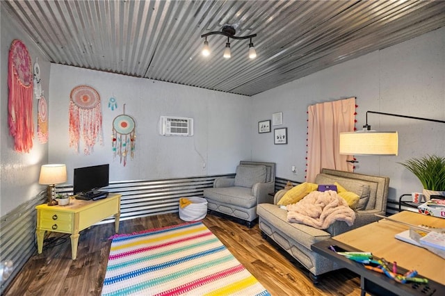 interior space featuring hardwood / wood-style flooring and an AC wall unit