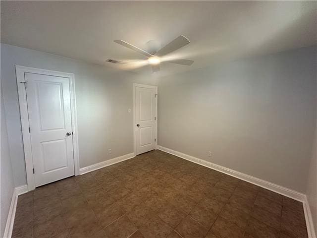 spare room with ceiling fan