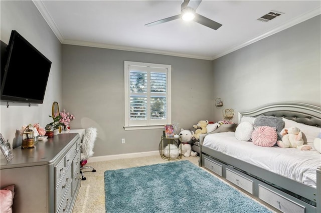 carpeted bedroom with ceiling fan and ornamental molding