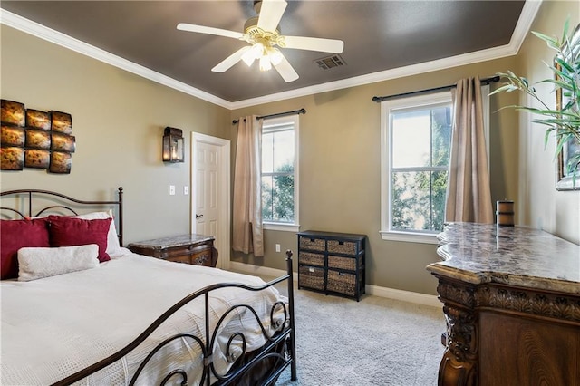 carpeted bedroom with ceiling fan, multiple windows, and crown molding