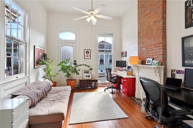 office space featuring wood-type flooring and ceiling fan