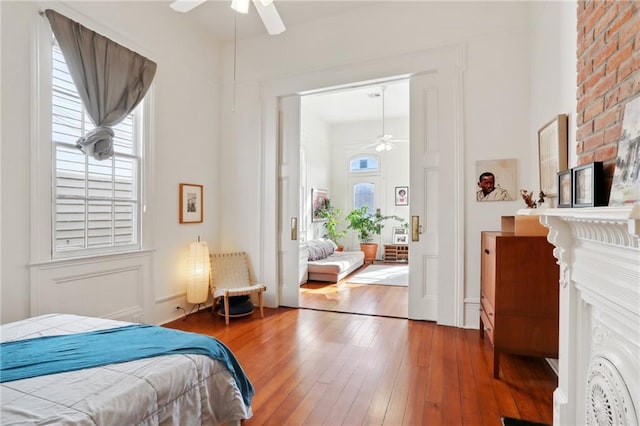 bedroom featuring ceiling fan and wood-type flooring