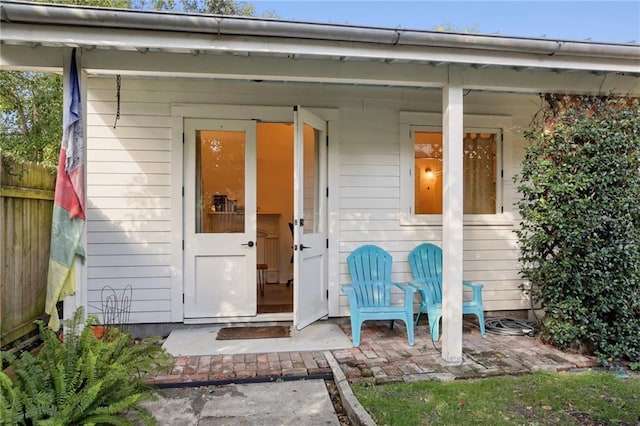 view of outdoor structure with covered porch