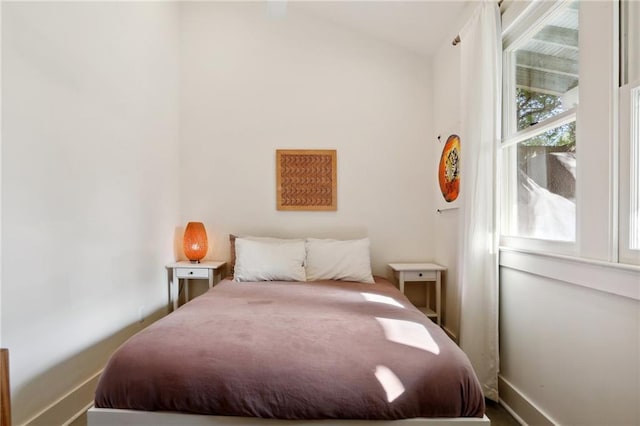 bedroom with lofted ceiling