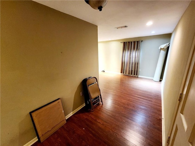 hallway featuring hardwood / wood-style flooring