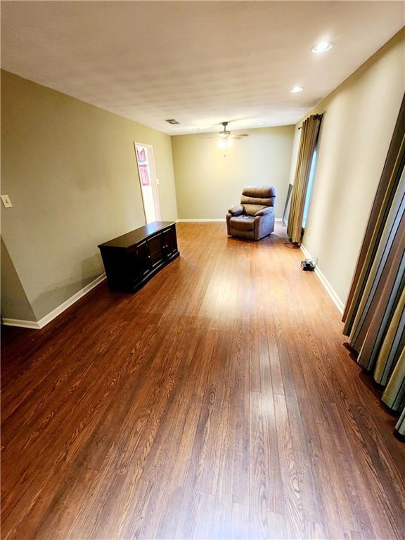 unfurnished room with hardwood / wood-style flooring