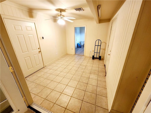 laundry room with crown molding and light colored carpet