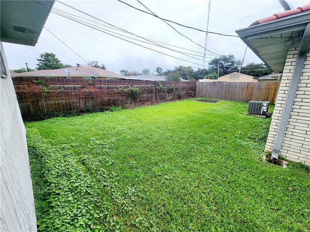 view of yard featuring central AC unit