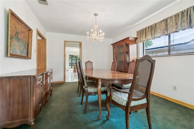 carpeted dining space featuring a chandelier