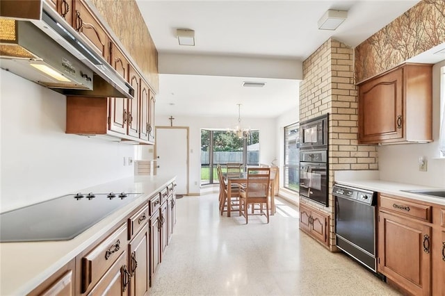 kitchen featuring wall oven, stovetop, an inviting chandelier, dishwasher, and stainless steel microwave