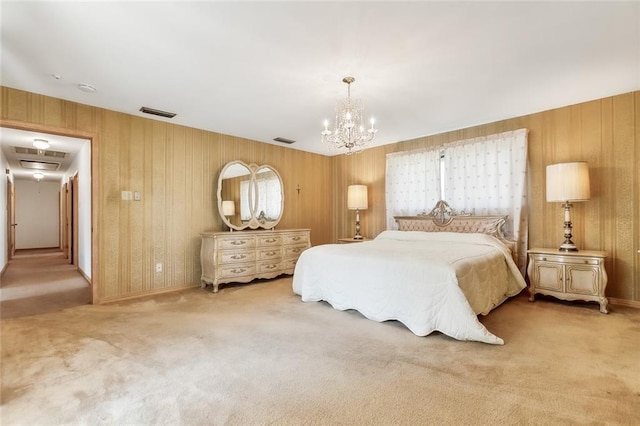 bedroom with carpet and a chandelier