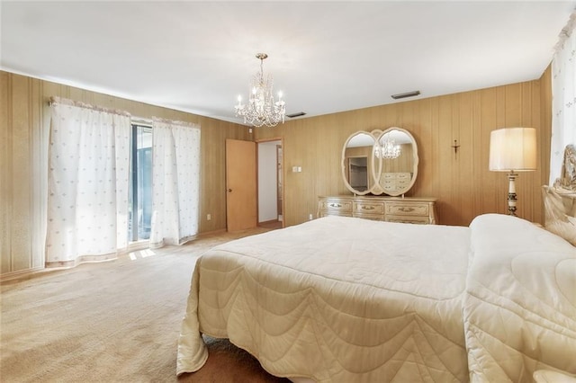 carpeted bedroom featuring a notable chandelier and wood walls