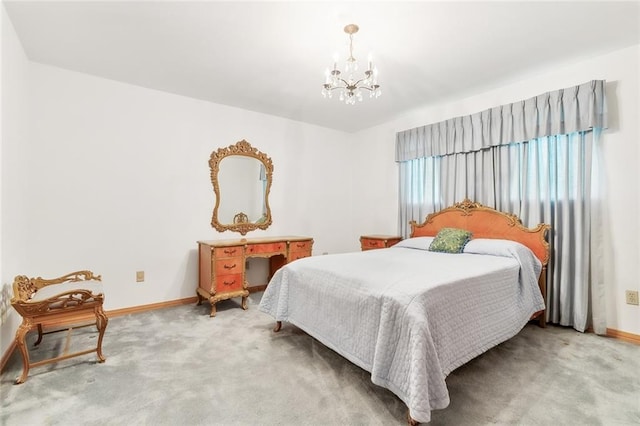 bedroom featuring carpet floors and a notable chandelier