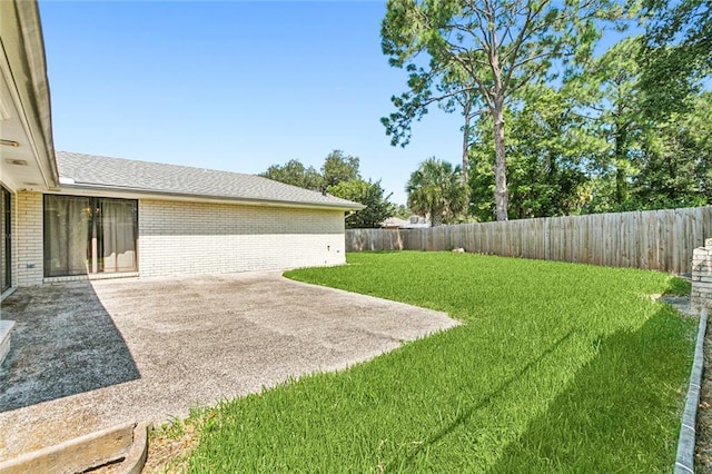 view of yard with a patio area