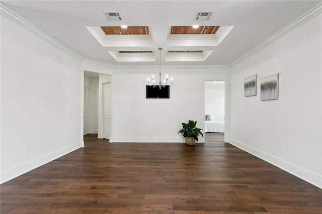 empty room with coffered ceiling, an inviting chandelier, dark hardwood / wood-style floors, and crown molding