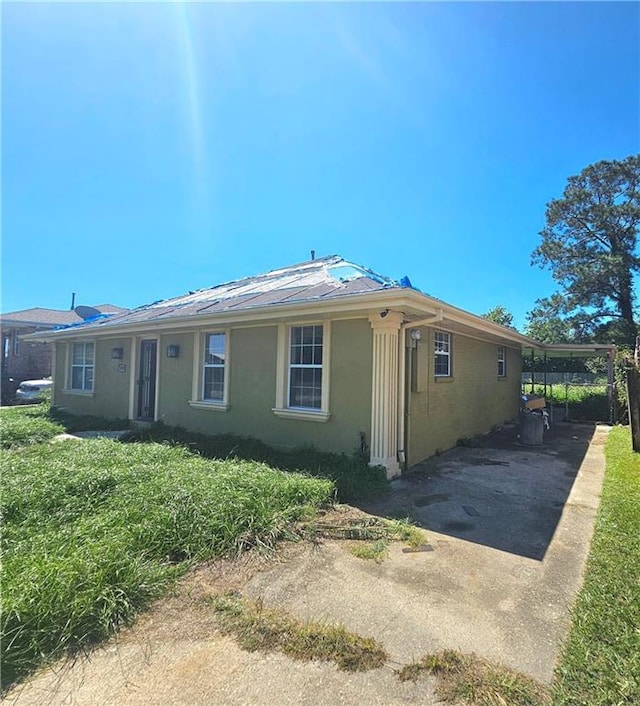 exterior space featuring a carport