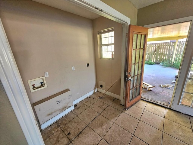 doorway with light tile patterned flooring