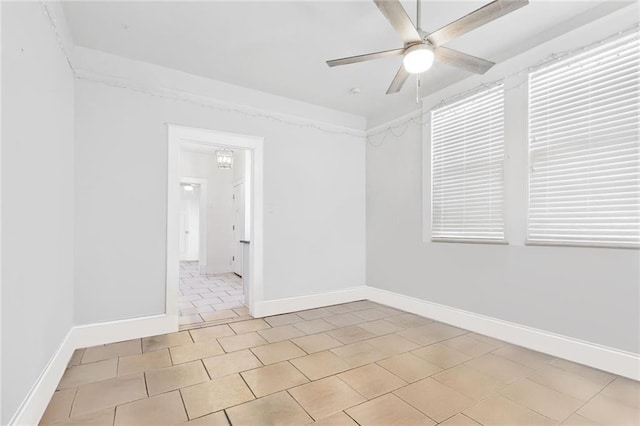 tiled empty room with ceiling fan