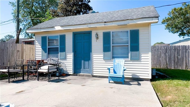 bungalow-style home with a patio area