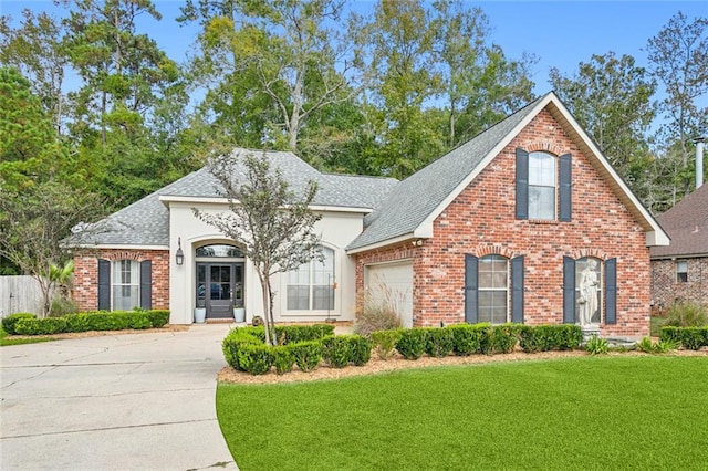 view of front facade with a front lawn and a garage