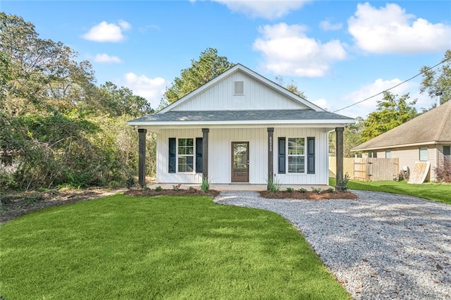 view of front of house featuring a front yard and a porch