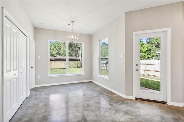 unfurnished dining area with an inviting chandelier