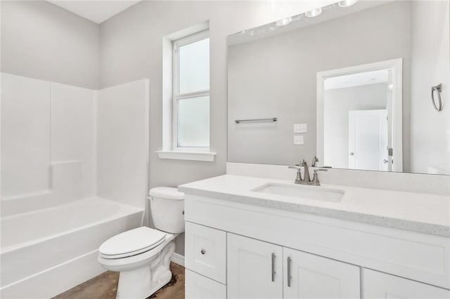 full bathroom with vanity, toilet, a healthy amount of sunlight, and shower / bathing tub combination