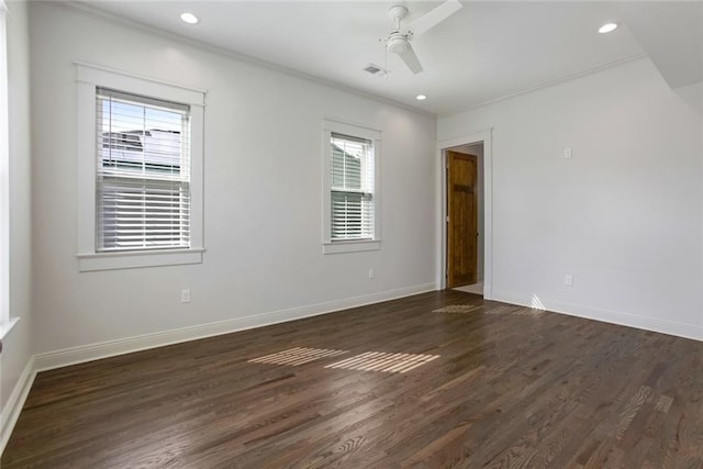 unfurnished room with plenty of natural light, ceiling fan, ornamental molding, and dark wood-type flooring