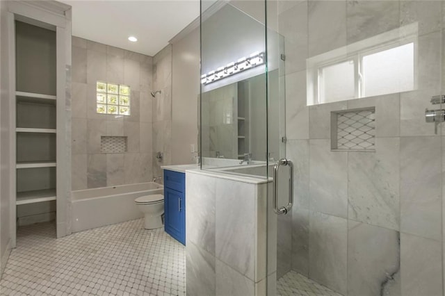 bathroom featuring tile patterned flooring, vanity, and toilet