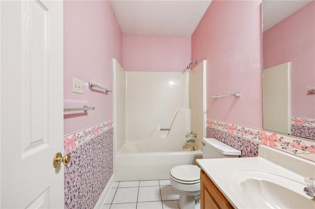 full bathroom featuring tile patterned flooring, vanity, toilet, and shower / bathtub combination