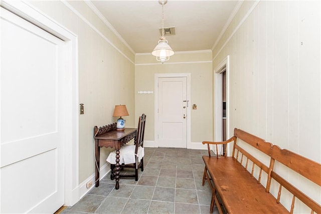 entryway featuring crown molding