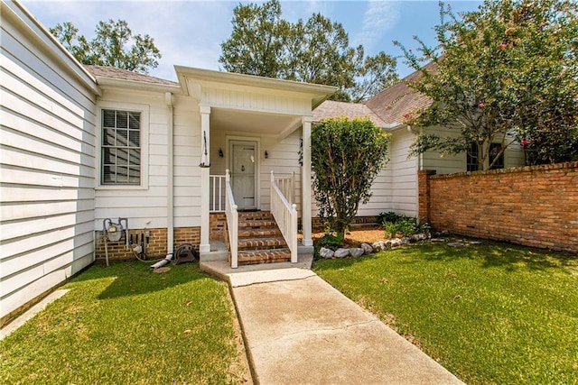 doorway to property with a yard