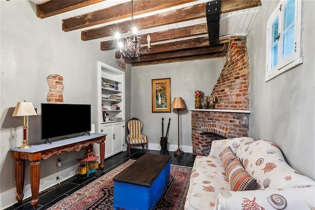 living room featuring a fireplace, a notable chandelier, beamed ceiling, and dark tile patterned flooring