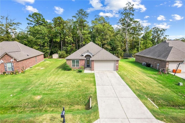 view of front of property with a garage and a front lawn