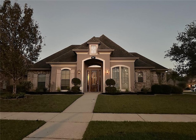 view of front of home with a front lawn