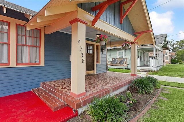 doorway to property with a porch