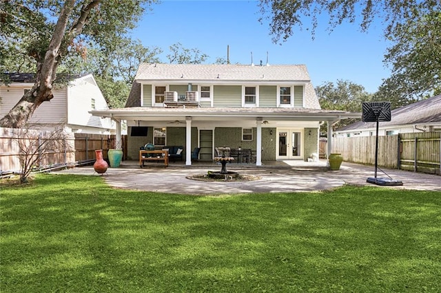 back of house with a yard, a patio, and french doors