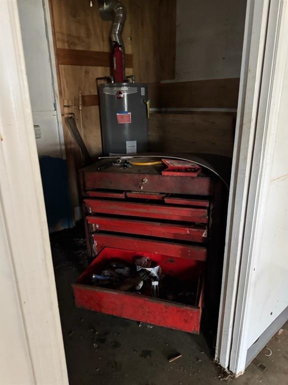 utility room with water heater