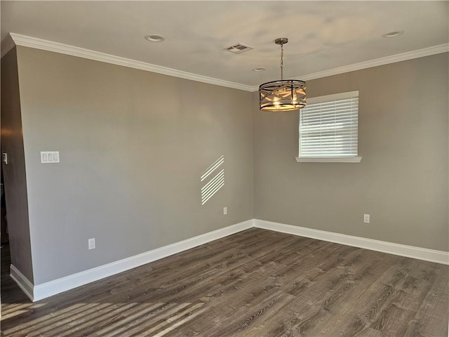 empty room with dark hardwood / wood-style floors, crown molding, and an inviting chandelier