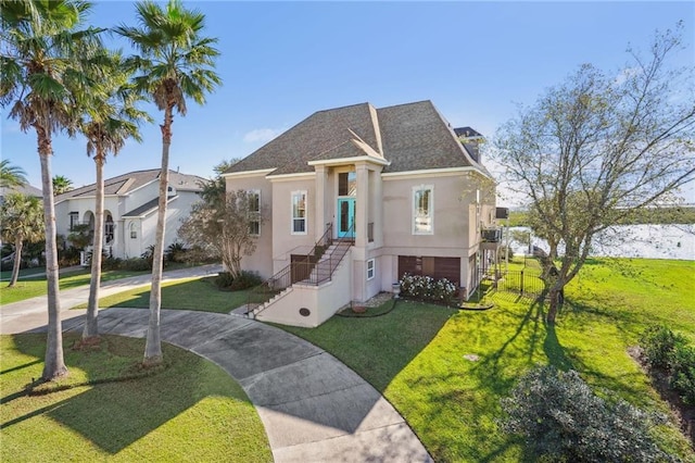 view of front facade with a garage and a front yard