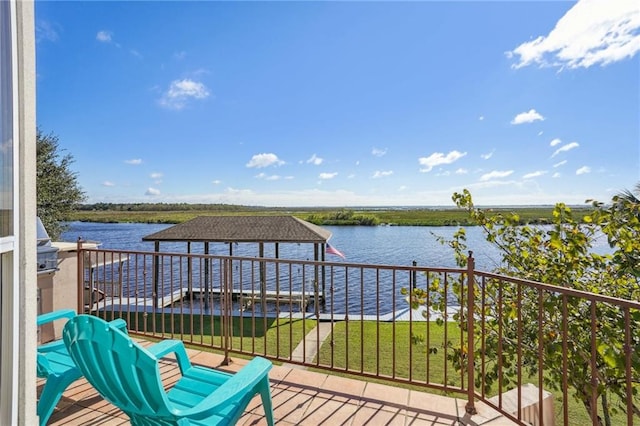 balcony featuring a water view