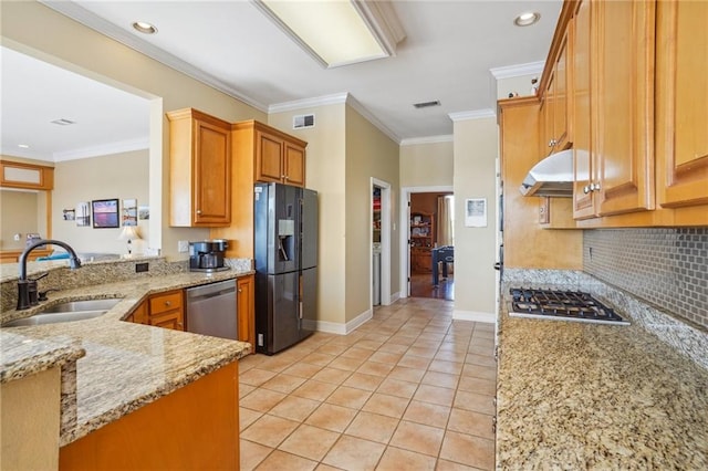 kitchen with sink, kitchen peninsula, light stone counters, appliances with stainless steel finishes, and ornamental molding