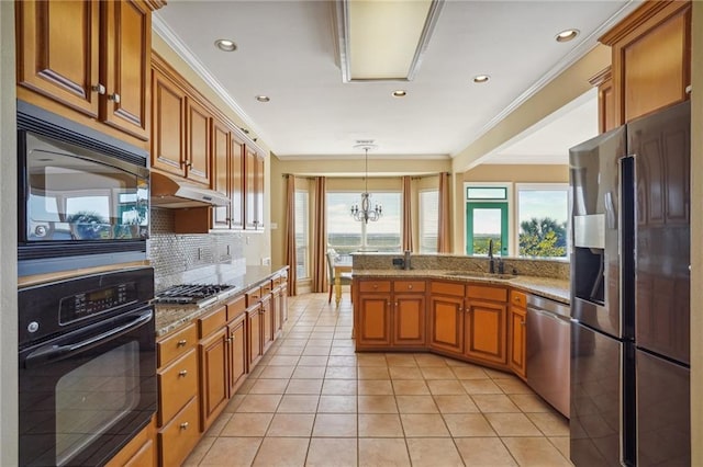 kitchen featuring light tile patterned flooring, black appliances, backsplash, an inviting chandelier, and decorative light fixtures