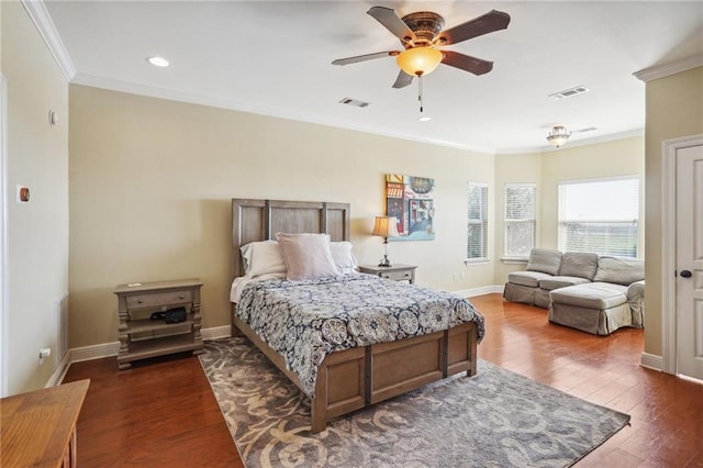 bedroom featuring ornamental molding, dark wood-type flooring, and ceiling fan