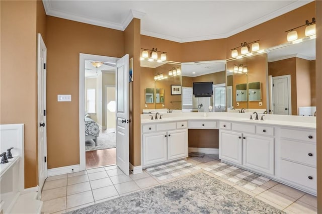 bathroom with ceiling fan, tile patterned flooring, vanity, and ornamental molding