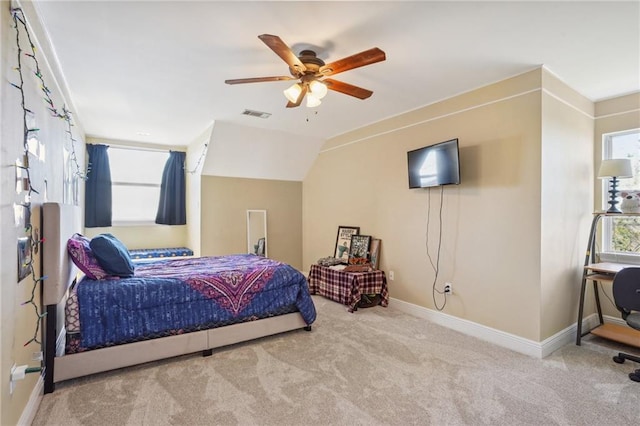 bedroom featuring light colored carpet and ceiling fan