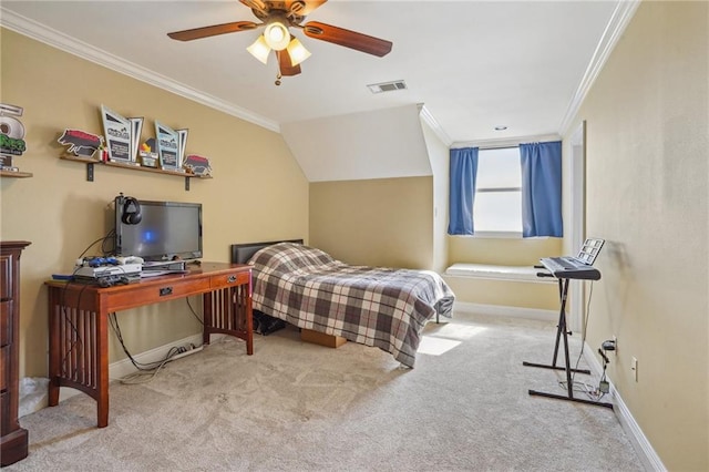 carpeted bedroom with ornamental molding, vaulted ceiling, and ceiling fan